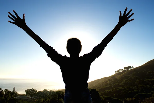 Silhouette of woman enjoying sunset — Stock Photo, Image