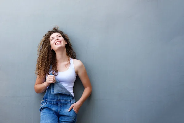 Trendy happy teen girl standing with hand in pocket — Stock Photo, Image