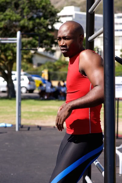 Young african man standing at exercise area outdoors — Stock Photo, Image