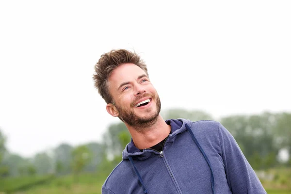 Cheerful athlete standing in park — Stock Photo, Image