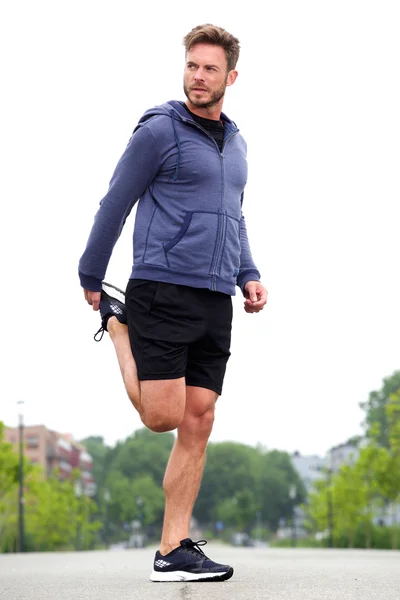 Attractive man doing stretch — Stock Photo, Image