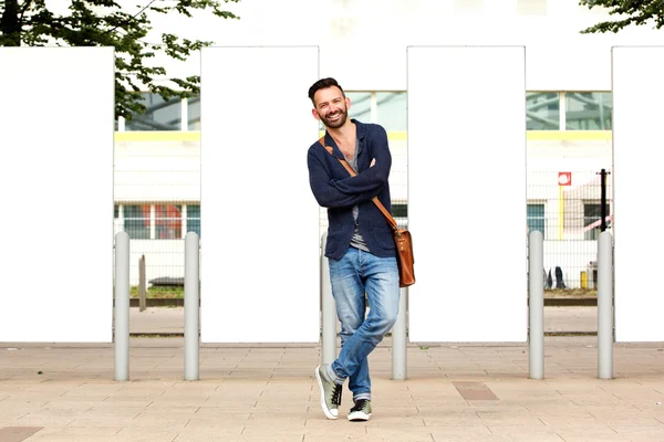 Stylish mature guy standing outdoors