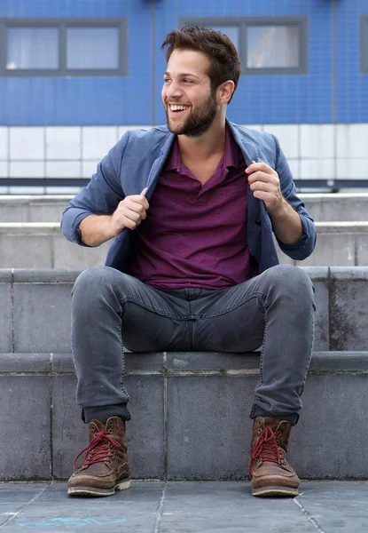 Cool guy sitting outside on steps — Stock Photo, Image