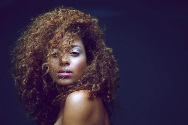 Beautiful female fashion model with curly hair — Stock Photo, Image