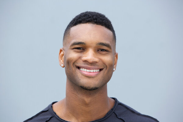 Close up portrait of a young black guy smiling