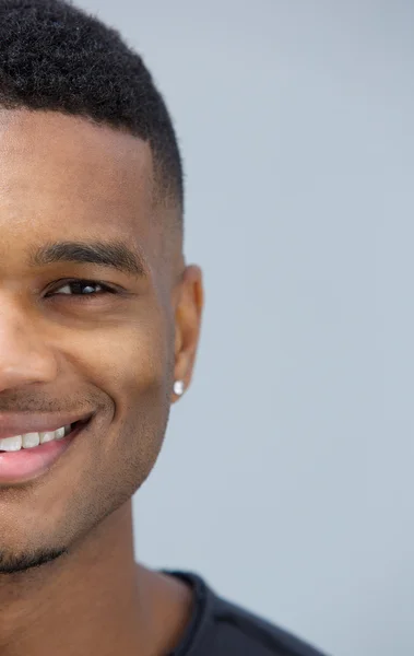 Half face portrait of a smiling man — Stock Photo, Image