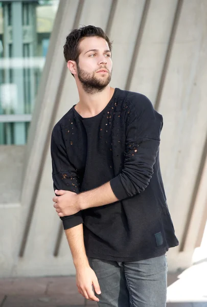 Male fashion model with beard posing outdoors — Stock Photo, Image