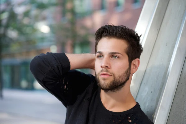 Cool guy posing with hand behind head — Stock Photo, Image