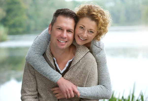 Happy mature couple smiling outdoors Royalty Free Stock Images