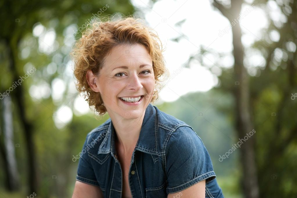 Happy older woman smiling outdoors