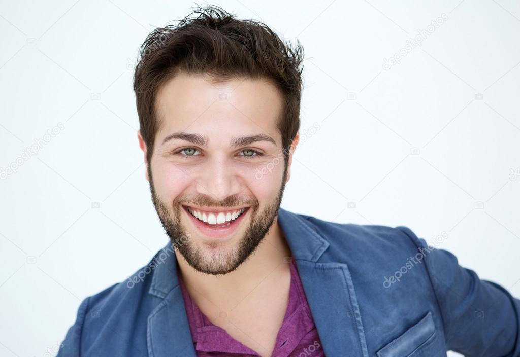 Attractive young man with beard smiling on white background 
