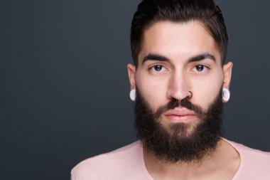 Young man with beard and piercings clipart