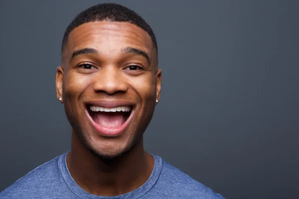 Young black man with funny smiling expression — Stock Photo, Image