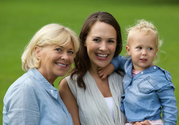 Mother grandmother and baby daughter smiling — Stock Photo, Image