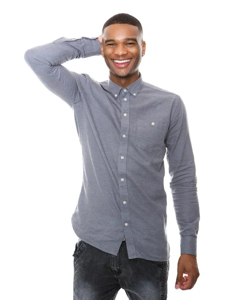 Smiling young black man with hand on head — Stock Photo, Image