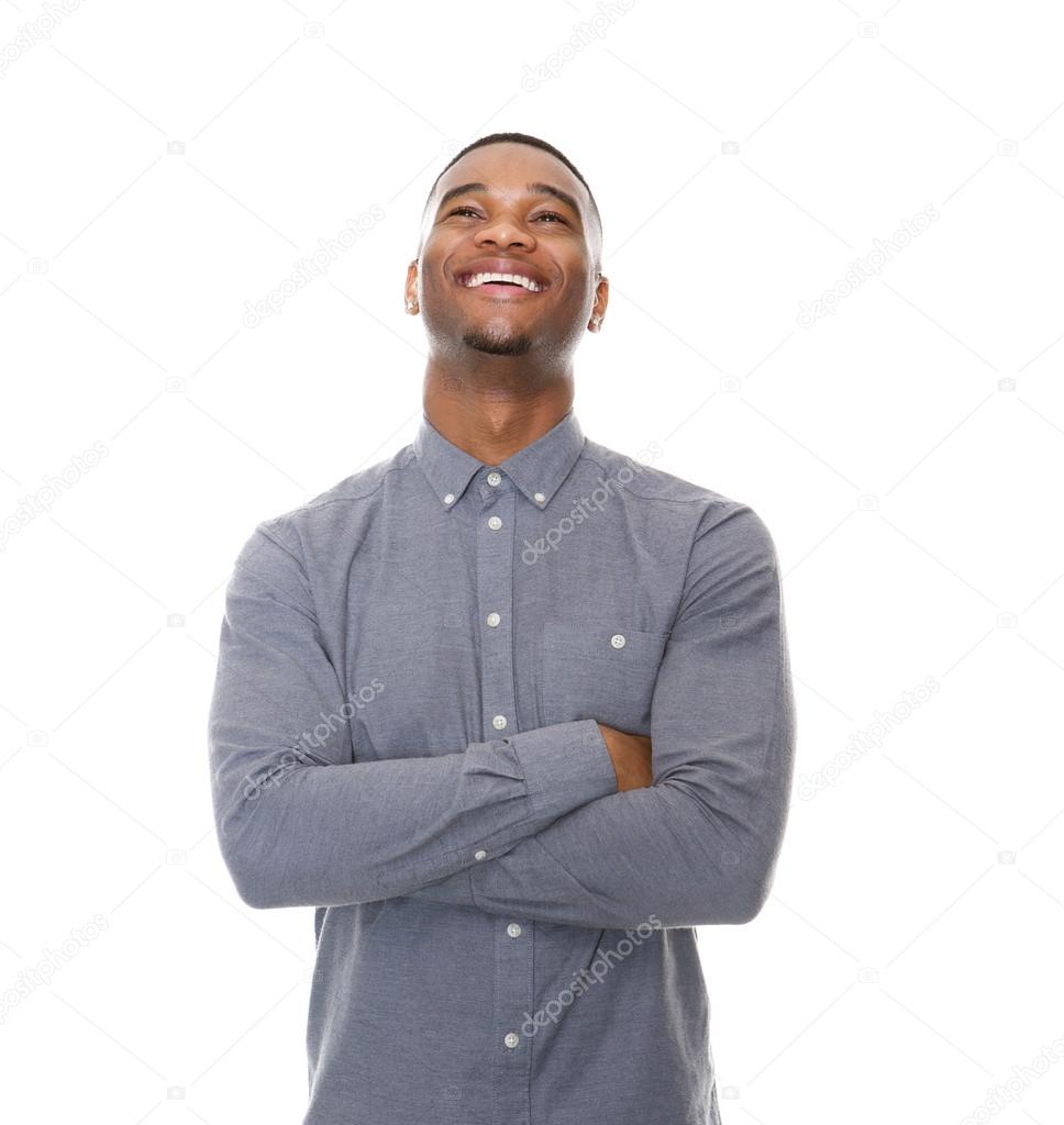 Laughing young black man with arms crossed 