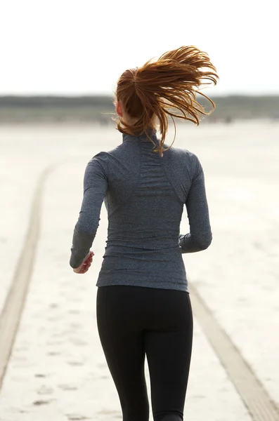 Rear view young woman running — Stock Photo, Image