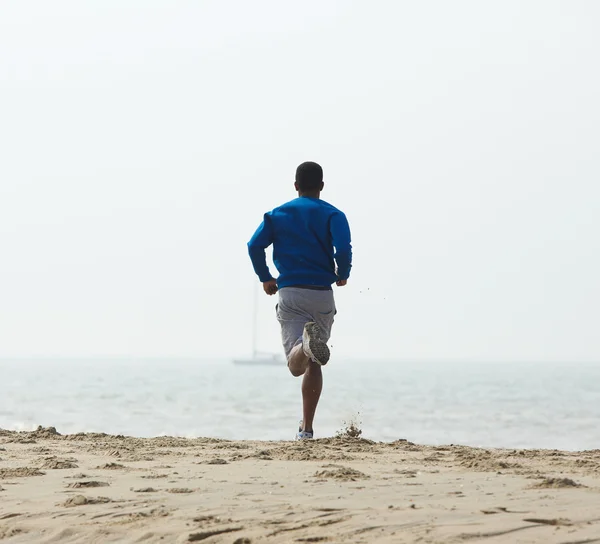 Visão traseira afro-americana homem jogging — Fotografia de Stock