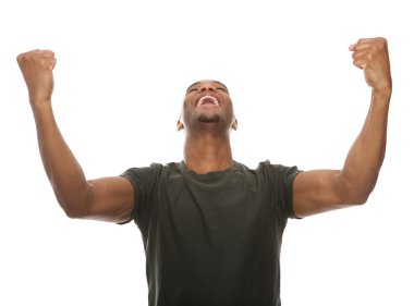 Cheerful young man shouting with arms raised in success