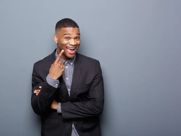 Cheerful african american business man pointing finger — Stock Photo, Image