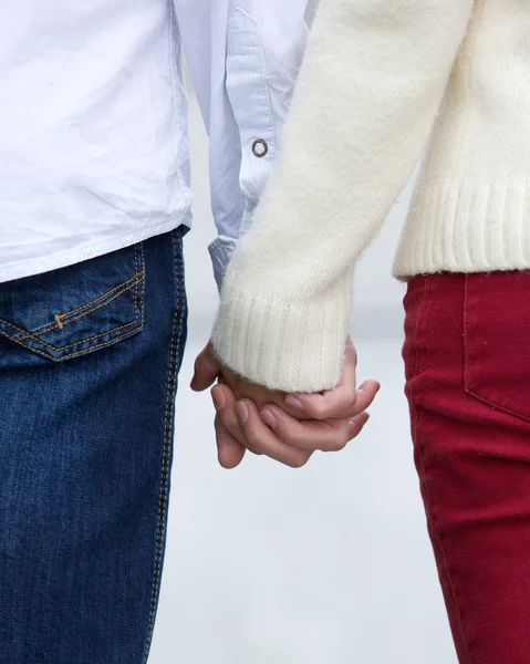 Rear view portrait of a young couple holding hands — Stock Photo, Image