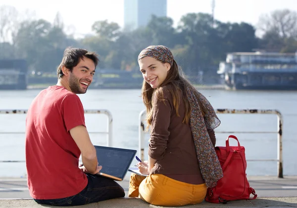 Rear view portrait of two college students smiling — Stock Photo, Image