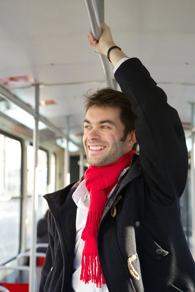 Mutlu genç adam metro ile seyahat — Stok fotoğraf