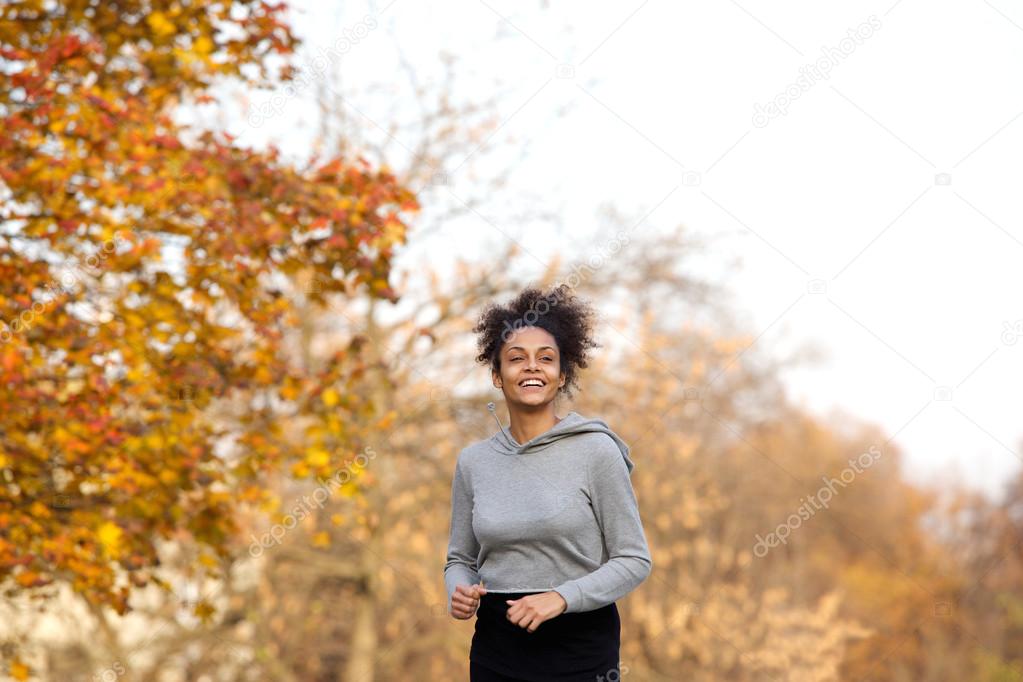 Young sports woman running in the park