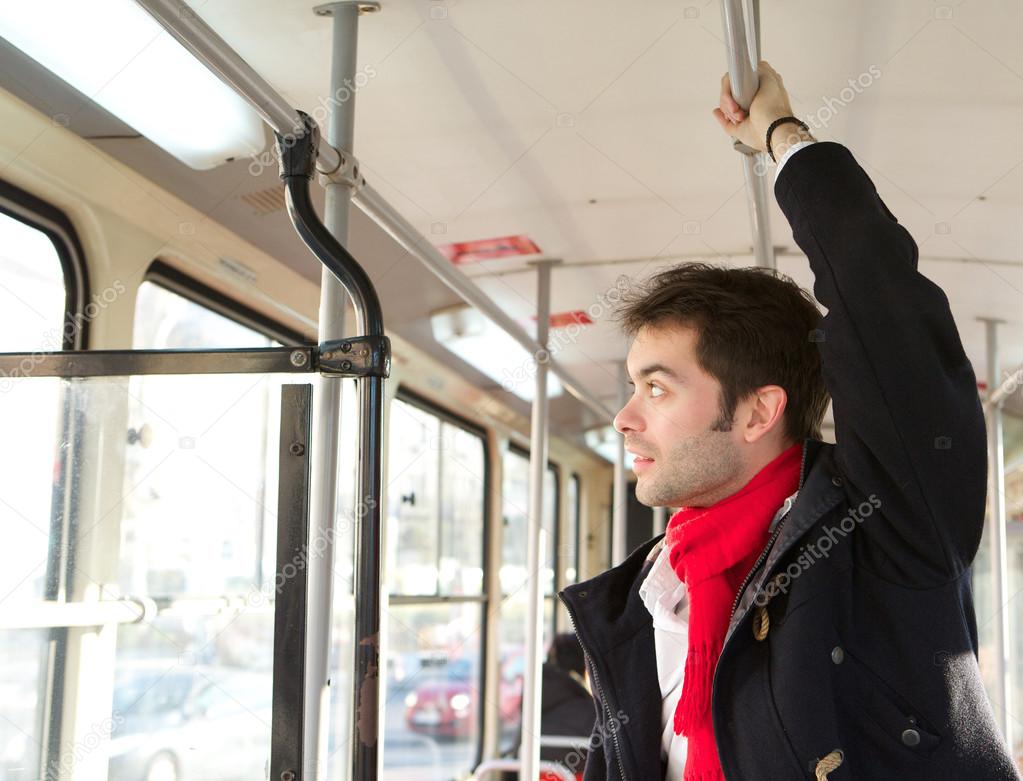 Young man traveling by public transport