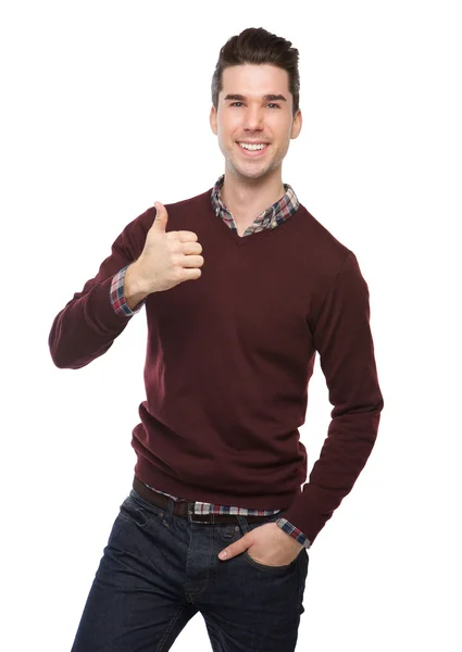 Selbstbewusster junger Mann lächelt mit Daumen hoch — Stockfoto