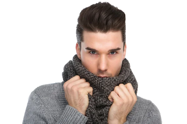 Handsome young man posing with gray wool scarf — Stock Photo, Image