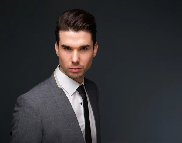 Attractive young man in business suit — Stock Photo, Image