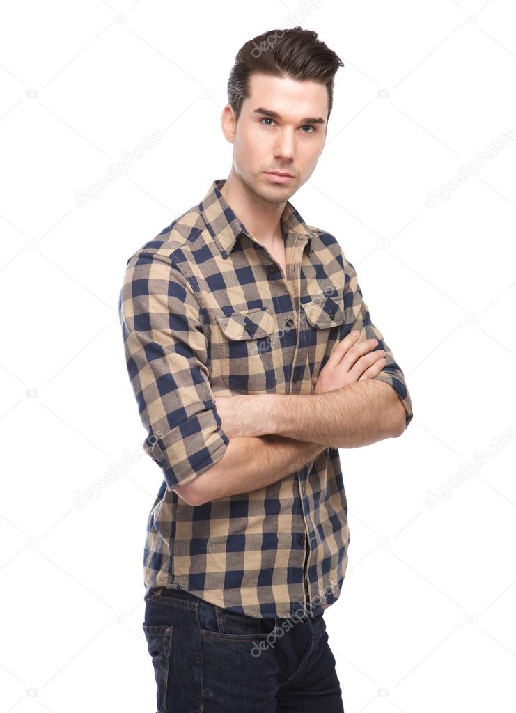 Confident young man posing with arms crossed 