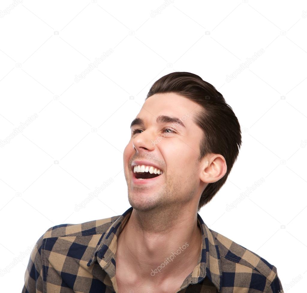 Close up portrait of a cheerful young man laughing 