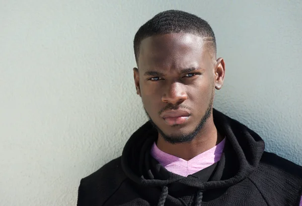 Close up portrait of a serious african american young man — Stock Photo, Image