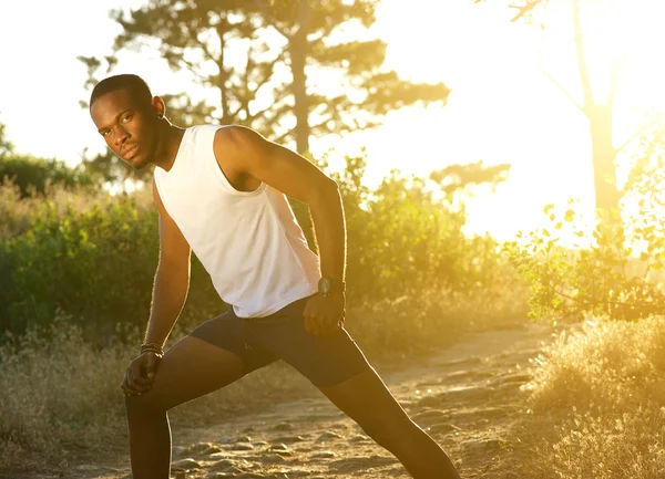 Handsome young man exercising outdoors — Stock Photo, Image