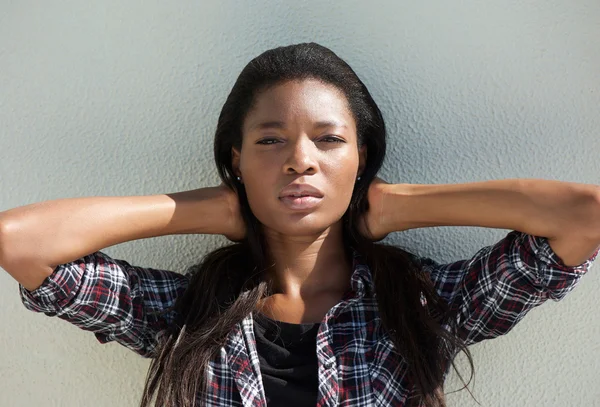 Attractive young african woman with hand in hair — Stock Photo, Image