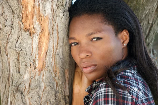 Beautiful young african american woman with long hair — Stock Photo, Image