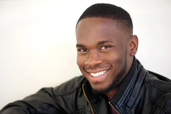 Happy young african american man smiling