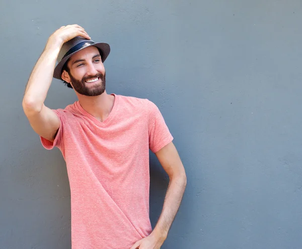 Happy young man smiling with hat — Stock Photo, Image