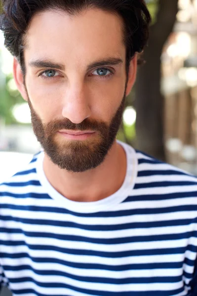 Male fashion model with beard and striped shirt — Stock Photo, Image