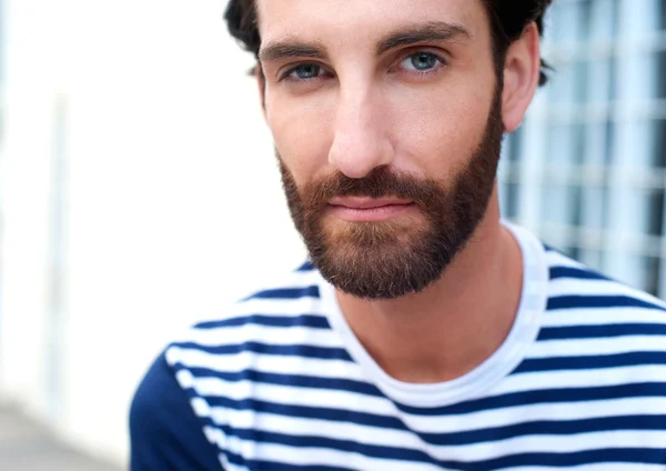 Handsome young man with beard staring — Stock Photo, Image