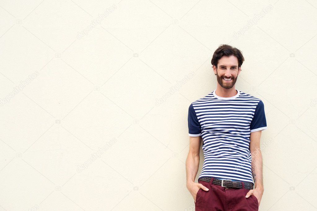 Confident young man smiling on white background