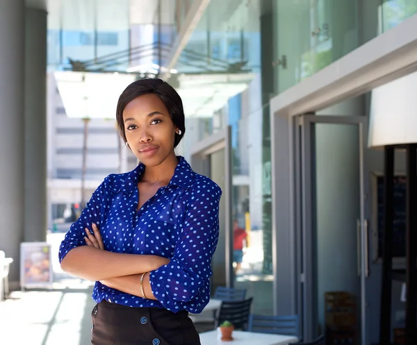 Female office worker standing outside business building — Stock Photo, Image