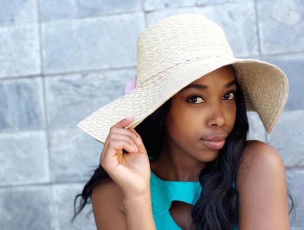 Beautiful african american woman with sun hat — Stock Photo, Image