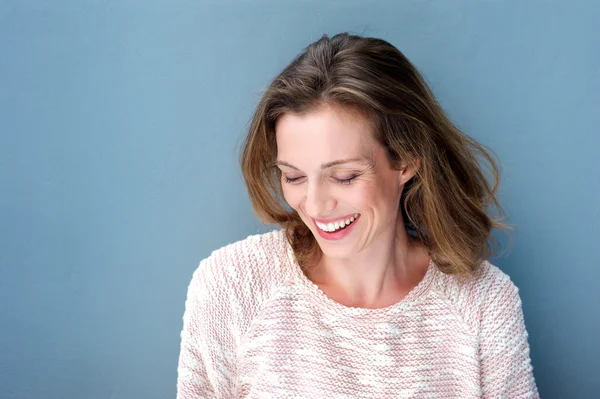 Beautiful mid adult woman laughing with sweater — Stock Photo, Image