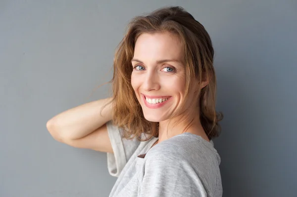 Happy smiling beautiful woman posing with hand — Stock Photo, Image