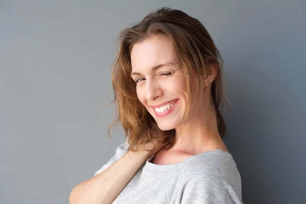 Beautiful woman winking her eye and flirting — Stock Photo, Image