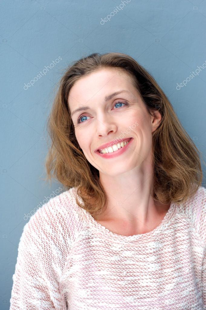 Natural relaxed older woman smiling with sweater