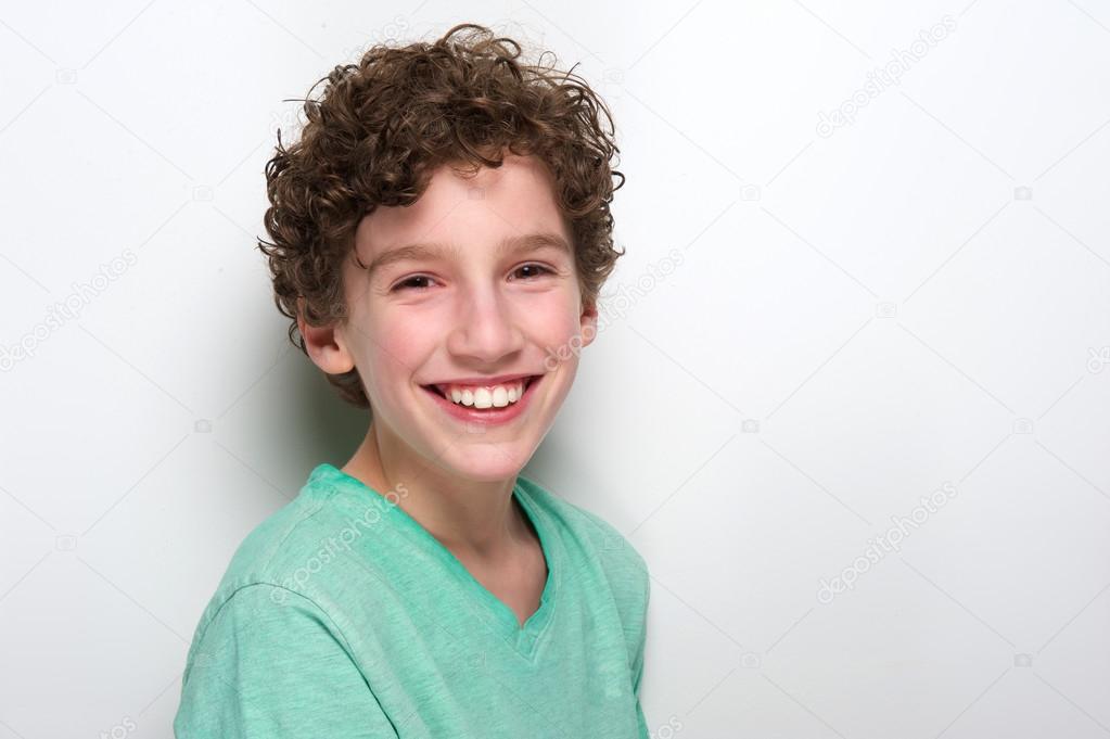 Cute boy with curly hair smiling